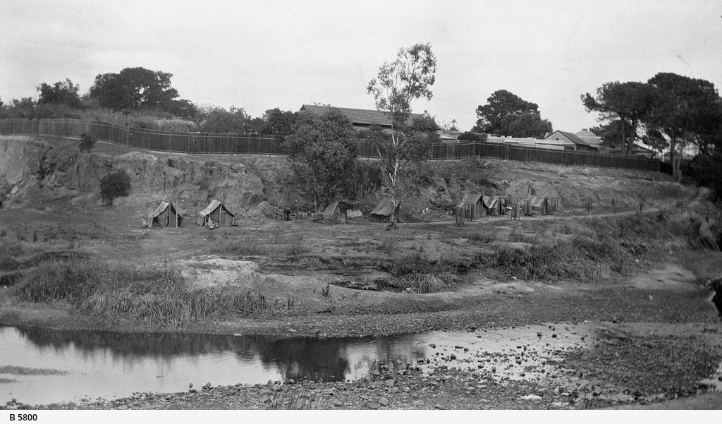  South Bank of the Torrens behind the Zoological Gardens, showing huts of hessian occupied by homeless men during the depression, 1930. SLSA: B 5800 