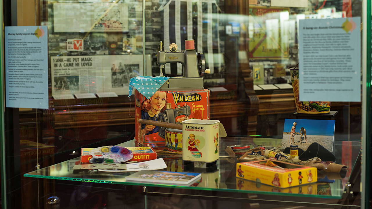 Display cabinet with 1950s toy and games.
