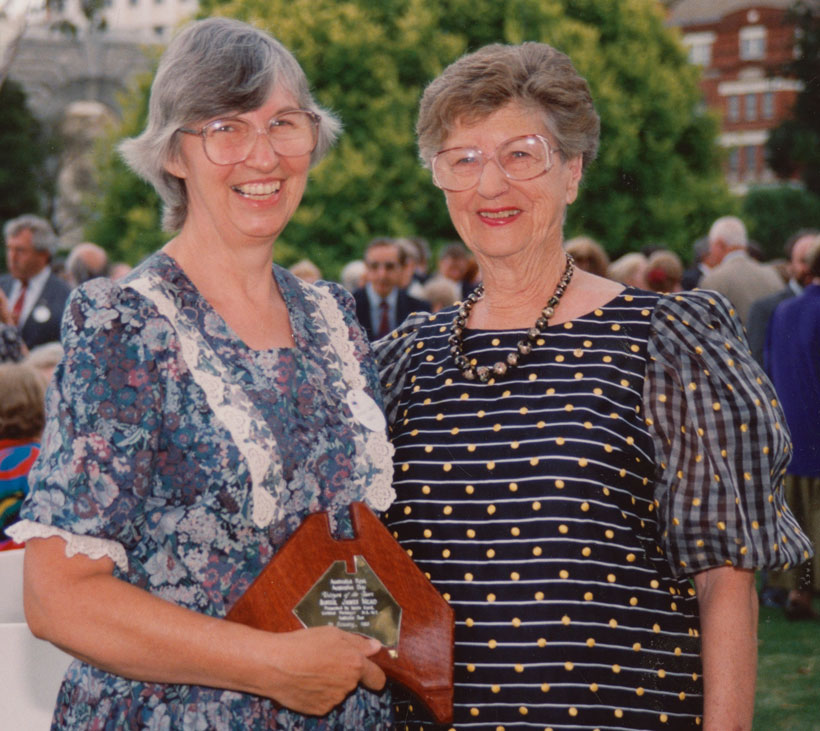 Sr Janet Mead holding an award, with Governor, Dame Roma Mitchell.