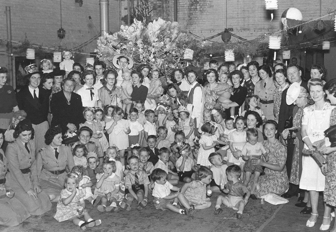 Members of the Women's Air Training Corps giving a children's Christmas party, 1942. SLSA: B 55027