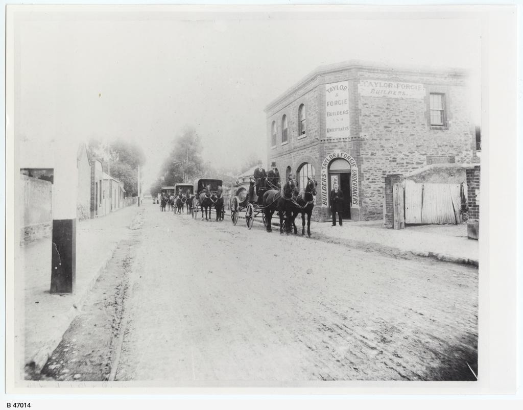 Horsedrawn Funeral cortege, Tod Street, outside the premises of Taylor & Forgie builders and undertakers. SLSA: B 47014