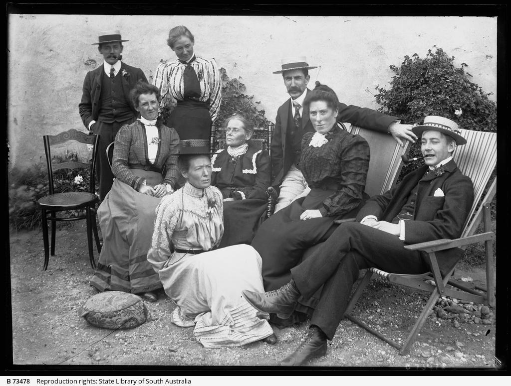 Group of people sitting in an Adelaide Hills garden. SLSA B 73478