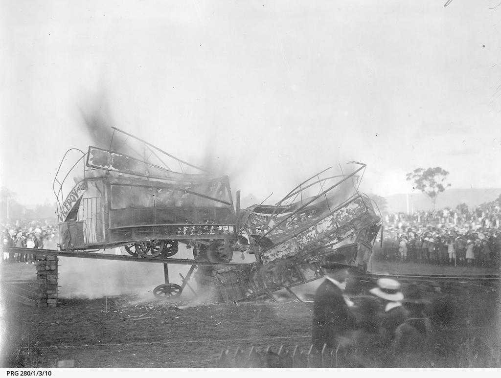 A mangled of metal, wood and flames. The tram collision is caught on camera, with a large crowd watching on. SLSA: PRG 280/1/3/10
