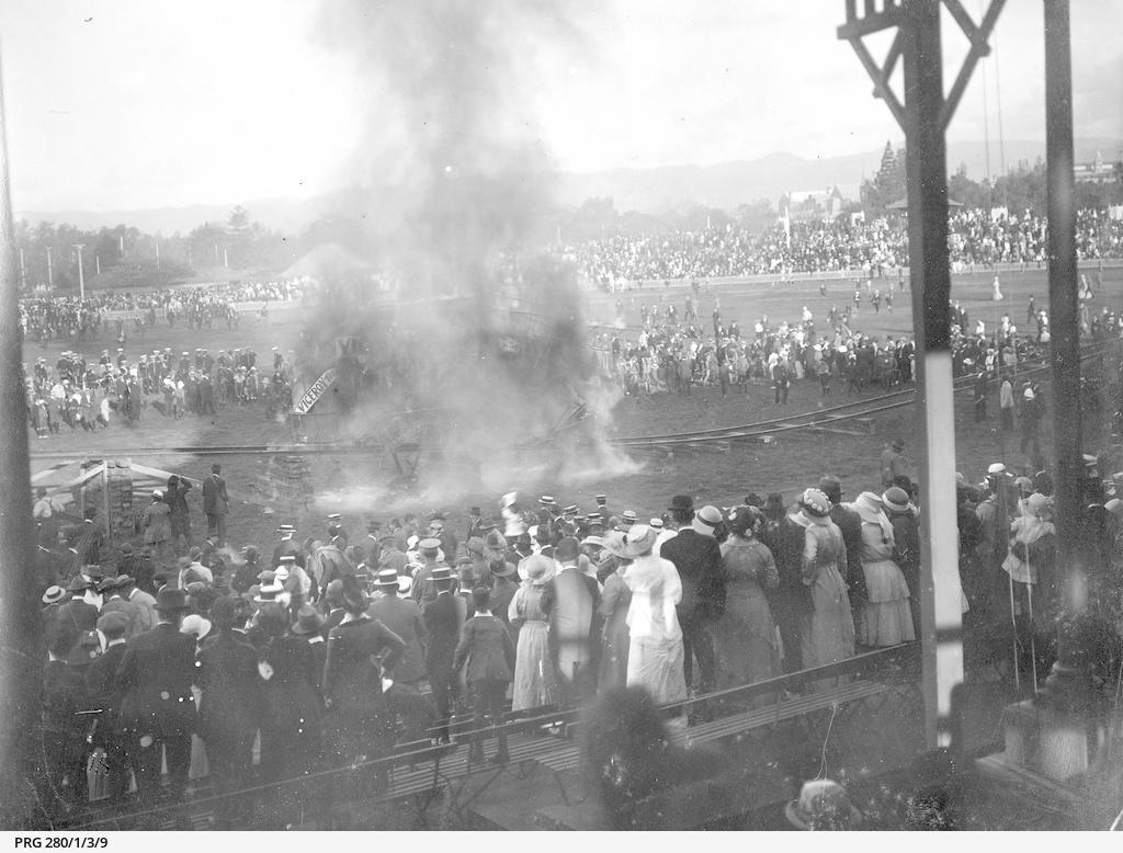 A mangled of metal, wood and flames. The tram collision is caught on camera, with a large crowd watching on. SLSA: PRG 280/1/3/9 