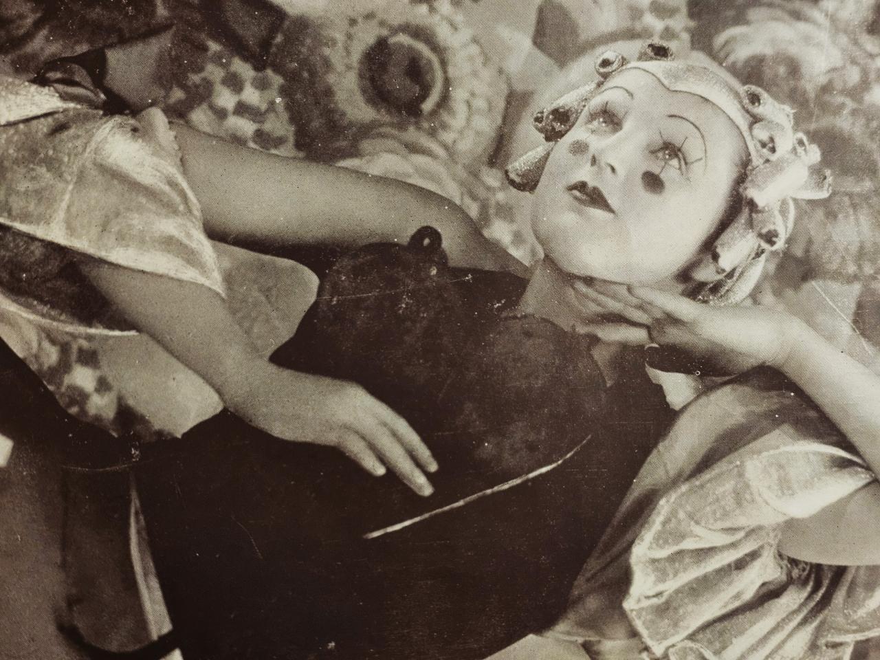 A reclining Thelma Thomas in her modernist version of Columbine character in play, 'The Merry Death'.