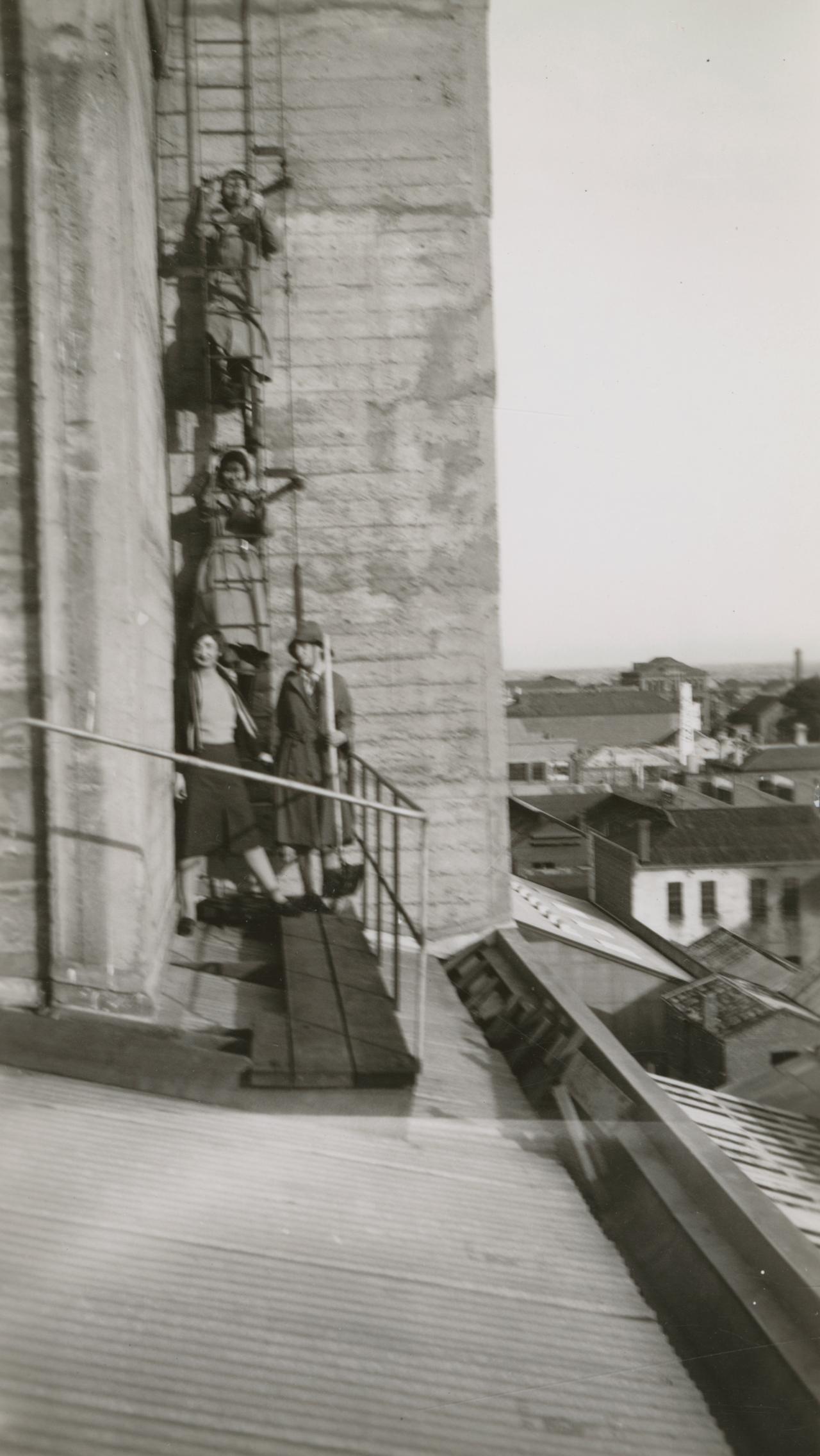 Climbing up the roof of the Duncan building for roof watching.