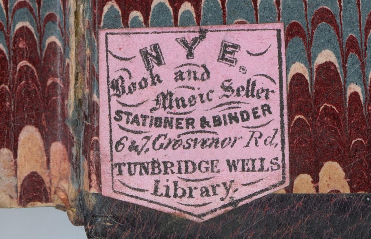 Book sticker on the back end page with the words 'Nyes book and music seller, stationer and binder, and library, 6 and 7 Grosvenor Rd, Tunbridge Wells.