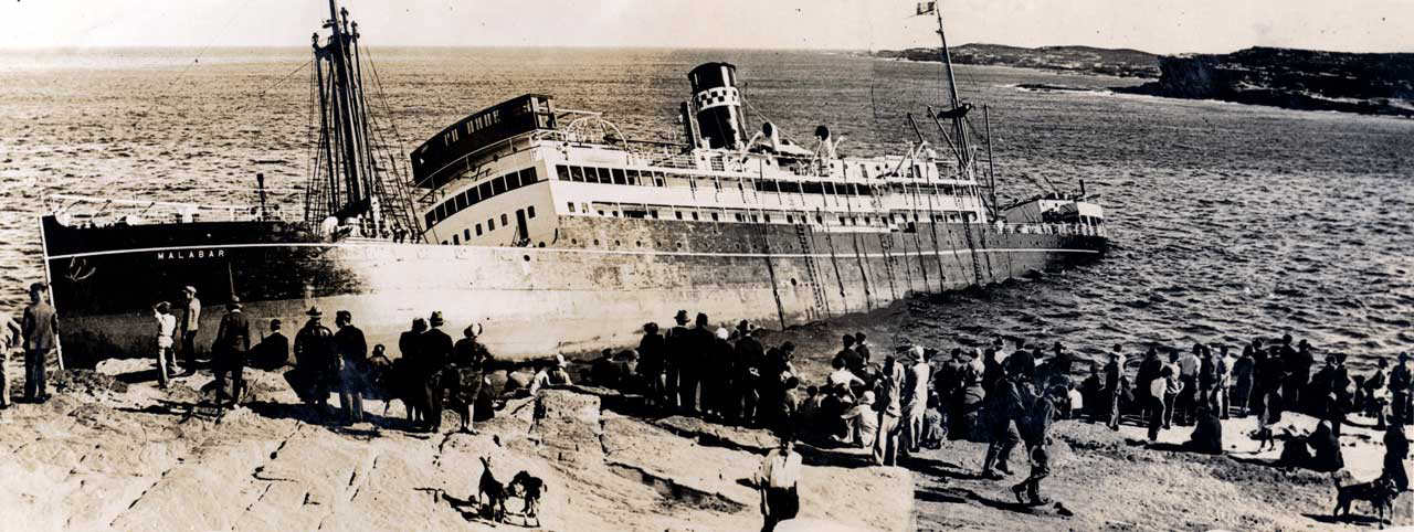 M.V. 'Malabar' listing in the water where it ran aground [SLSA: PRG 1638/9/314] 