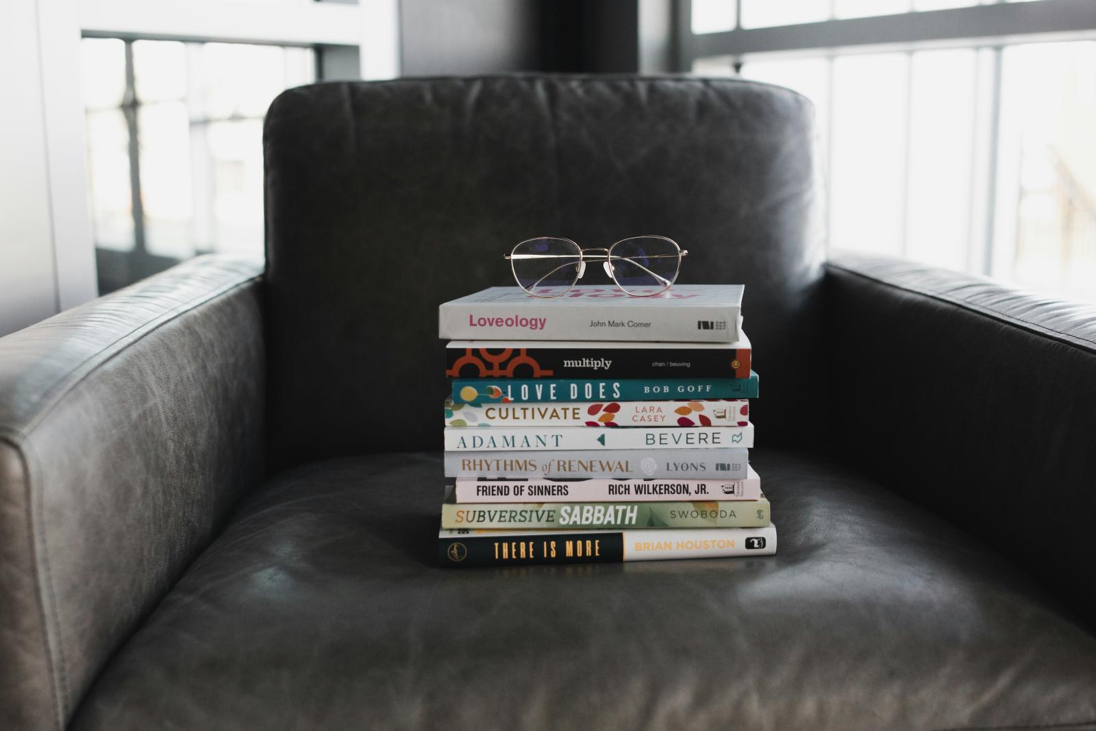 Photo by alexandra fuller assorted-books-on-black-couch. Unsplash     
