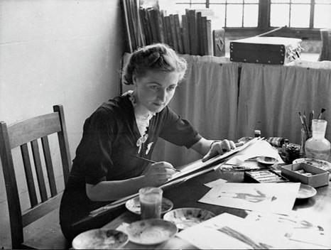 Thelma Thomas sitting at table sketching