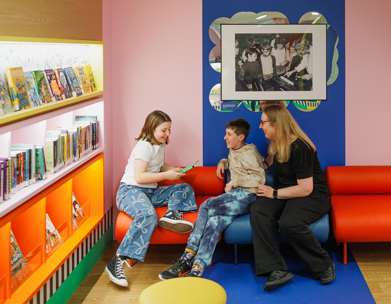 People in the Little Library enjoying a book