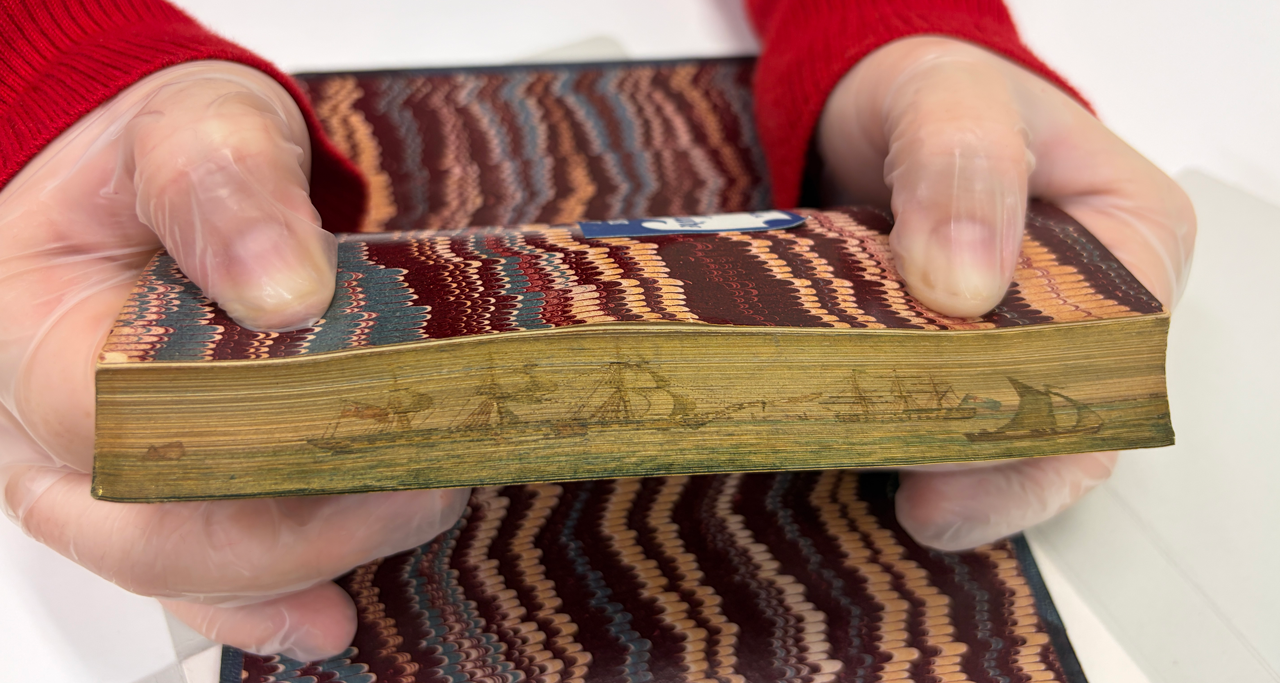 Fore-edge painting of ships on the book Rhymes for the Romantic and Chivalrous by the anonymous author D.W.D