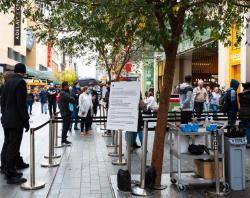 Customers queued to enter Apple Store, Rundle Mall [SLSA: B 78533/90] 