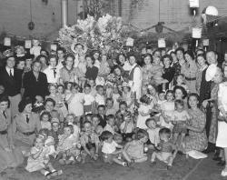 Members of the Women's Air Training Corps giving a children's Christmas party, 1942. SLSA: B 55027