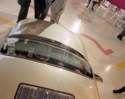 Holden’s ECOmmodore project lead engineers discuss the solar panels on car's roof. SLSA: BRG 213/199/8/2/154 