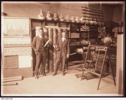 Two employees in front of WC Brooke& Co. furnishings display