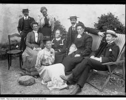 Group of people sitting in an Adelaide Hills garden. SLSA B 73478