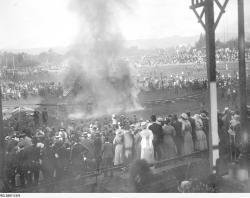 A mangled of metal, wood and flames. The tram collision is caught on camera, with a large crowd watching on. SLSA: PRG 280/1/3/9 