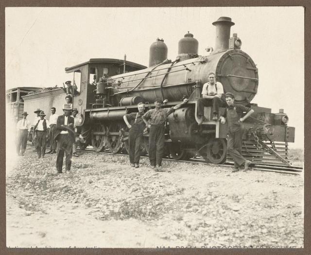 Locomotive and men. NAA: B3114, Photograph 50 Volume 4