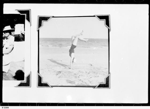 Hand stand on the beach