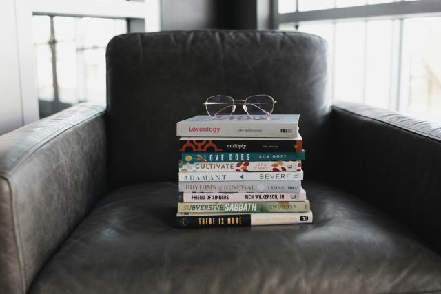 Photo by alexandra fuller assorted-books-on-black-couch. Unsplash     