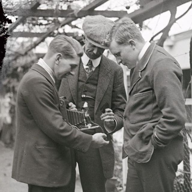 Three men with a camera, [PRG 1316/3/160/2