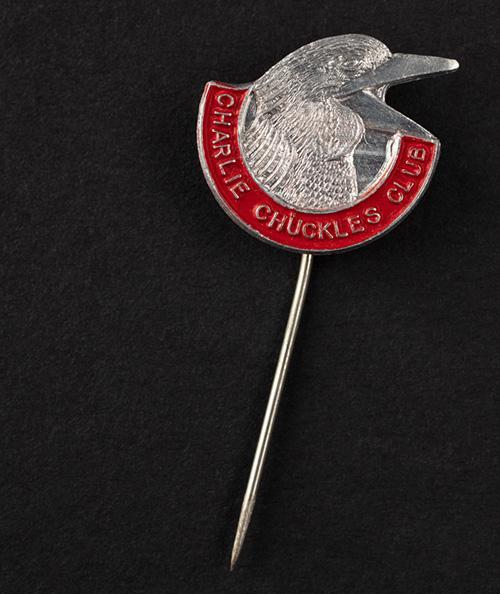 ‘Charlie Chuckles’ lapel or hat pin, red enamel, in the shape of a kookaburra, ca. 1940s, 1.5 cm SLSA: clrcri22706379/2
