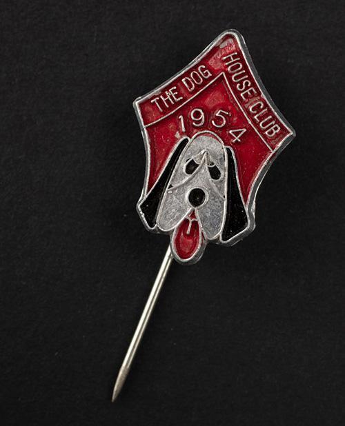 ‘The Dog House Club’ lapel or hatpin, red and black enamel, in the shape of a hound, 1954, 1.5cm.  SLSA: clrcri22706379/3