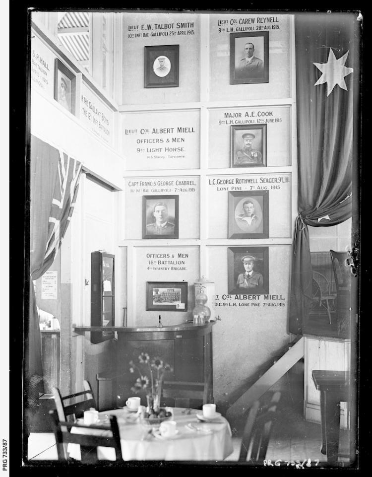 Memorial wall in the Adelaide Cheer-up Hut with memorials to Lieutenant Eric W. Talbot Smith, Lieutenant Colonel Carew Reynell, Lieutenant Colonel Albert Miell, Major Alfred E. Cook, Captain Francis George Chabrel, Lance Corporal George Seager and Captain Sydney Raymond Hall. SLSA: PRG 733/87 